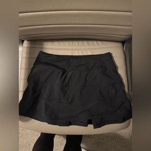 Black pace rival mid rise skirt.